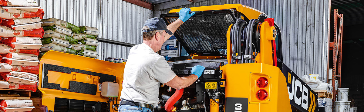 Man working on JCB equipement